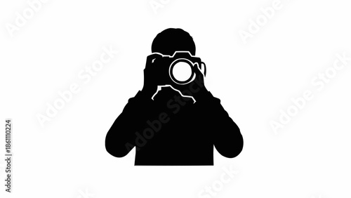 Silhouette of a person holding a camera and taking a photo.