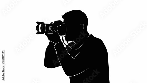 Silhouette of a person holding a professional camera and taking a photo.