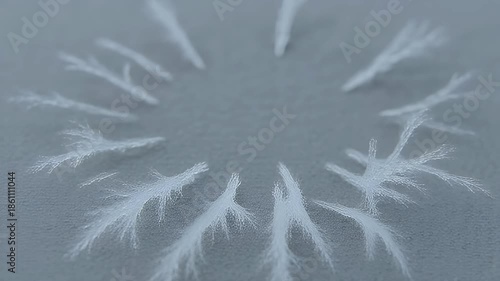 Raindrops falling on gray surface creating ripples