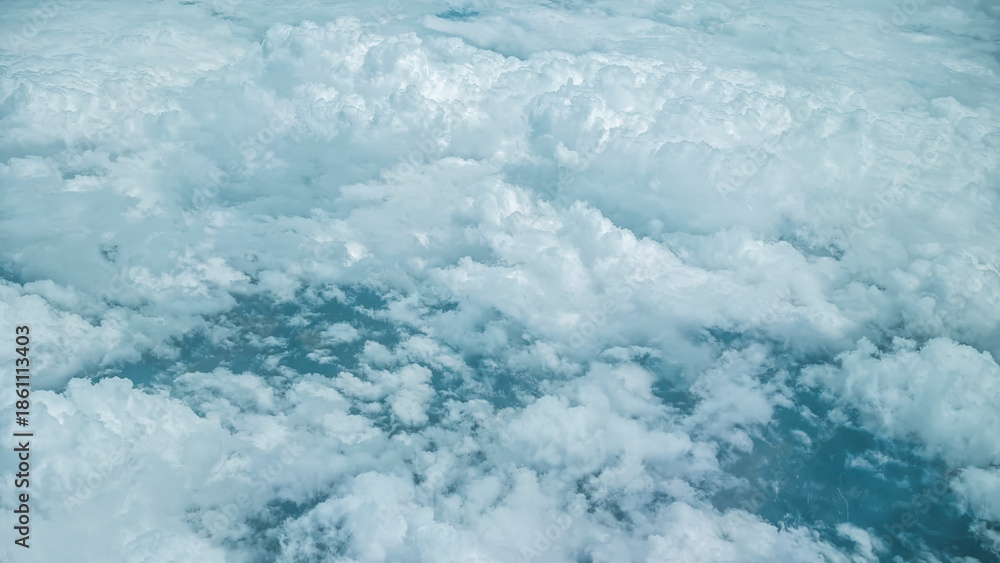 Fototapeta premium Fluffy white clouds under blue sky