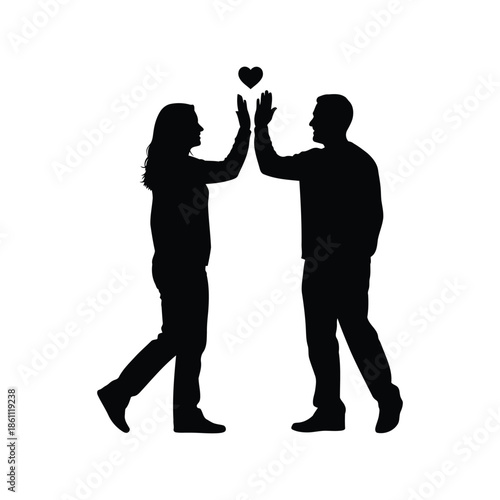 Silhouette of Couple in Love Making Heart Gesture