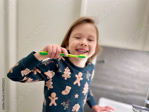 little girl brushing teeth