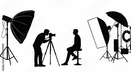 Photographer taking picture of person in studio with lighting equipment.