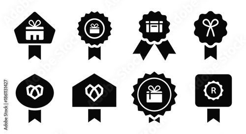 A collection of decorative award ribbons and badges in a striking black silhouette