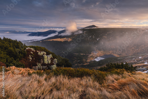 Autumn landscapes of the Karkonosze Mountains near Śnieżka, captured before winter. Dramatic sunrise and sunset light over ridges, valleys, and alpine scenery.
