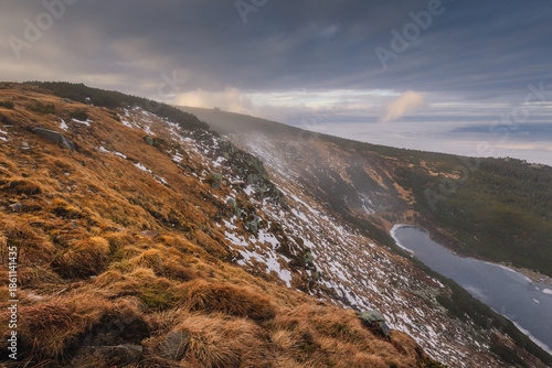 Autumn landscapes of the Karkonosze Mountains near Śnieżka, captured before winter. Dramatic sunrise and sunset light over ridges, valleys, and alpine scenery.