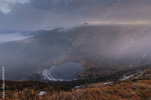 Autumn landscapes of the Karkonosze Mountains near Śnieżka, captured before winter. Dramatic sunrise and sunset light over ridges, valleys, and alpine scenery.