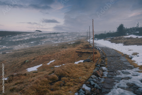 Autumn landscapes of the Karkonosze Mountains near Śnieżka, captured before winter. Dramatic sunrise and sunset light over ridges, valleys, and alpine scenery.