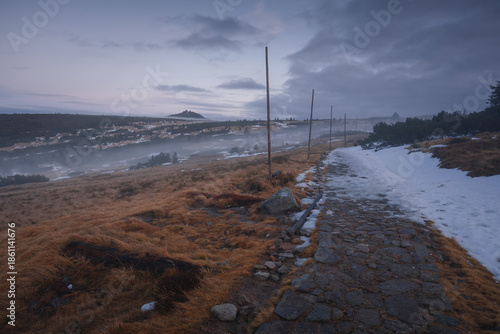 Autumn landscapes of the Karkonosze Mountains near Śnieżka, captured before winter. Dramatic sunrise and sunset light over ridges, valleys, and alpine scenery.