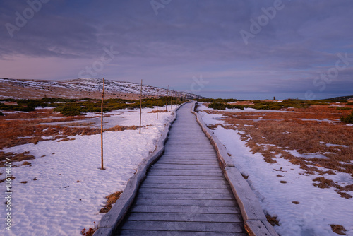 Autumn landscapes of the Karkonosze Mountains near Śnieżka, captured before winter. Dramatic sunrise and sunset light over ridges, valleys, and alpine scenery.
