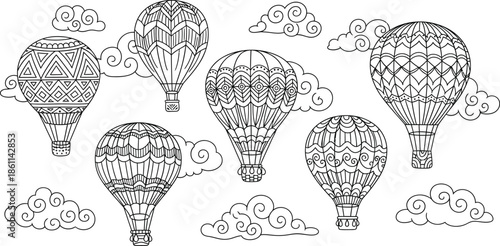 Vibrant hot air balloons floating serenely amidst fluffy white clouds