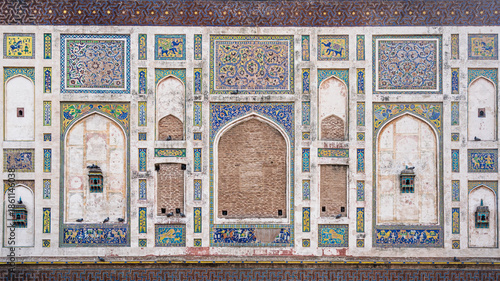 Detail of colorful mosaic decoration on historic Picture Wall built by mughal emperor Jahangir in fort, Lahore, Punjab, Pakistan 
