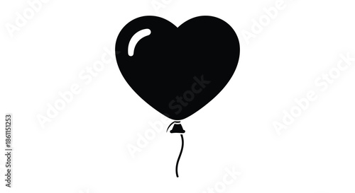A striking black heart shaped balloon floats gently a simple yet evocative silhouette