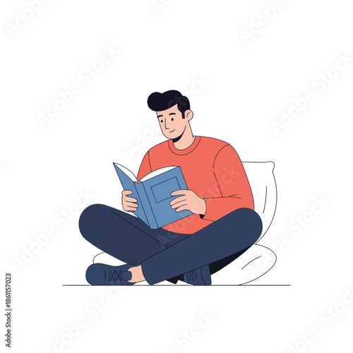 Man reading book while sitting cross-legged on cushion, focused, calm, home leisure