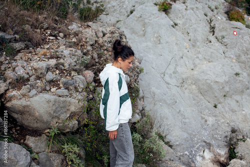 young pretty brunette girl hiking to waterfall, lifestyle people concept