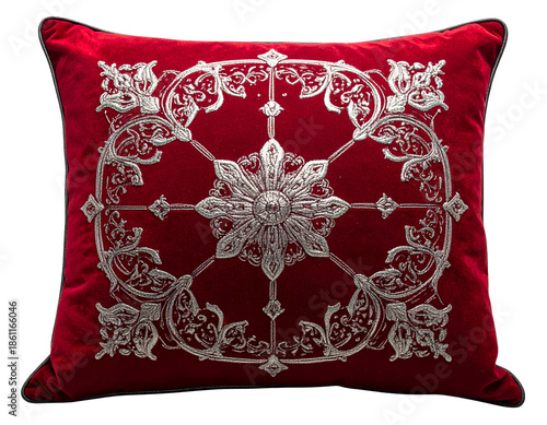 Plush red pillow with intricate silver embroidery