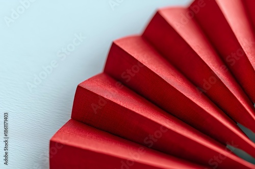 Red pleated paper fan symbolizing chinese new year celebrations and traditional asian culture concept