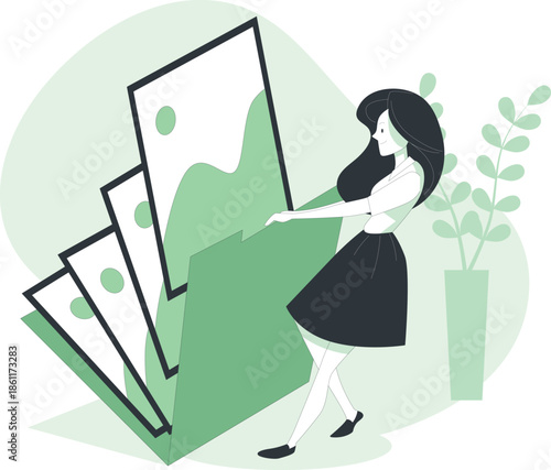 Woman arranging pictures of mountains in a modern minimalist space