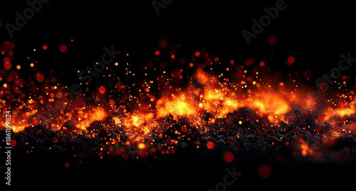 Fiery abstract horizontal scene with glowing orange and red sparks and embers against black