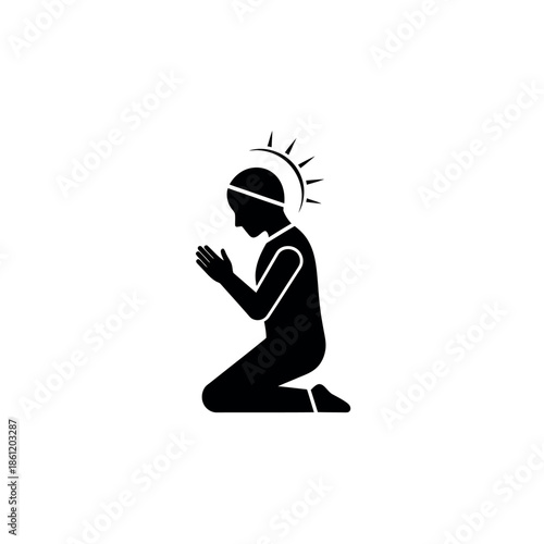 Silhouette of a person kneeling in prayer with a halo symbolizing devotion and spirituality.