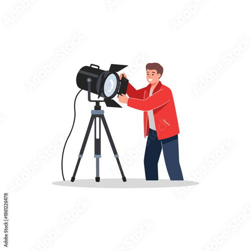 Man Adjusting Spotlight on Tripod Stand.