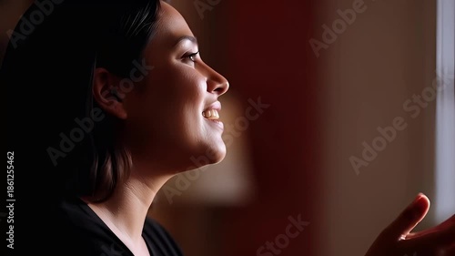 Smiling businesswoman with dark hair looking confident