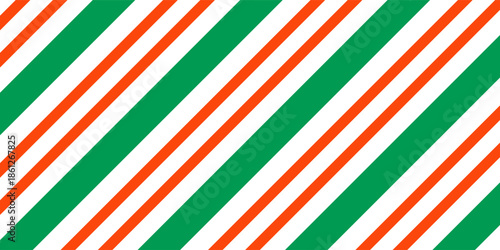 Christmas seamless pattern. Red and green diagonal stripes background. Candy cane repeating decoration wallpaper. Winter holiday lines backdrop. vector