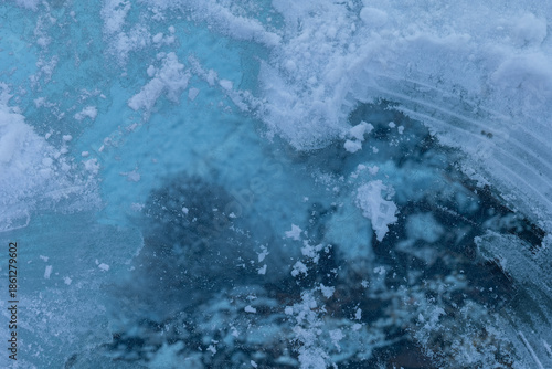 Captivating icy texture revealing depths beneath a frozen surface during a tranquil winter morning