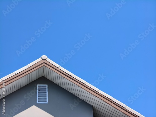 An architectural details of roof with a clear sky background. The simple design evokes a sense of minimalism and tranquility