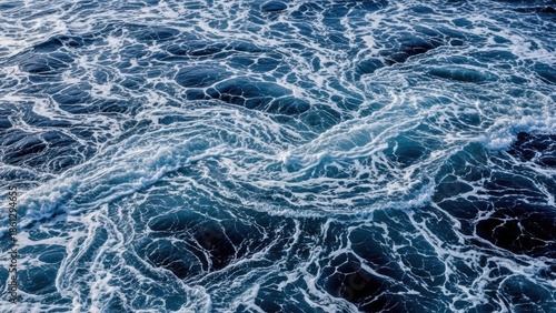 Deep blue ocean waves with white foam