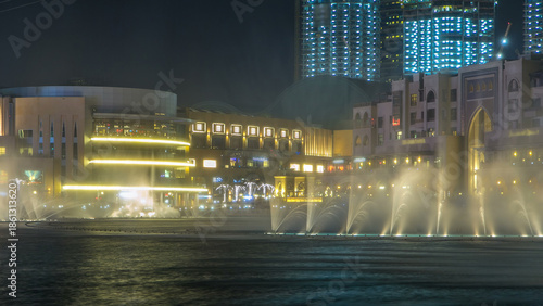 The Dancing Fountain of Dubai and lake day to night timelapse at dusk in Duba...