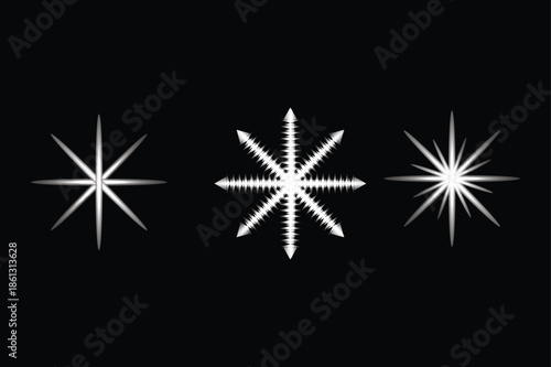 A collection of three distinct white star, snowflake, and sparkle designs on a black background