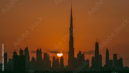 Sunset with skyline of Downtown Dubai in the evening timelapse.