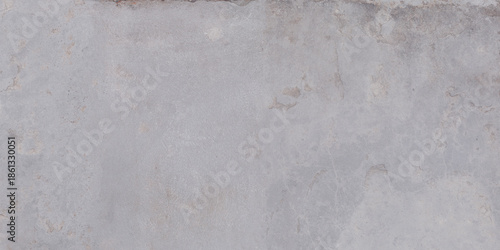 The rough surface of a stone slab with a concrete hue. Design for porcelain tiles