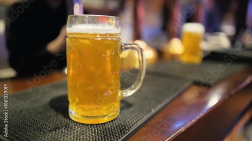 Wallpaper Mural Closeup of frothy beer mug atmosphere, Detailed shot of beer in bar setting with warm lighting Torontodigital.ca