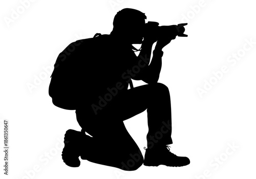 Dynamic silhouette of a dedicated photographer kneeling with camera and backpack, ready to capture compelling visual stories, perfect for creative projects and media needs