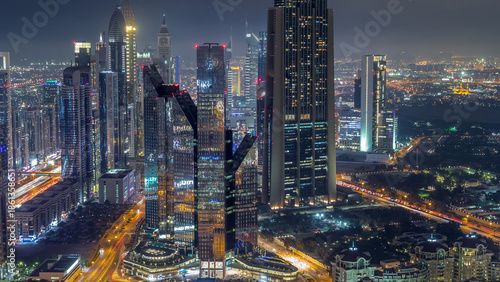 Obraz na plátně Dubai International Financial Centre district with modern skyscrapers day to nig