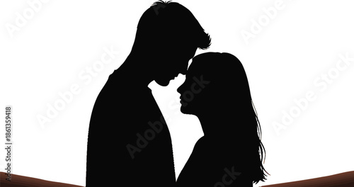 Silhouette of a romantic couple embracing tenderly against a warm golden sunset sky background