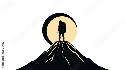 Silhouette of a hiker standing on a mountain peak.