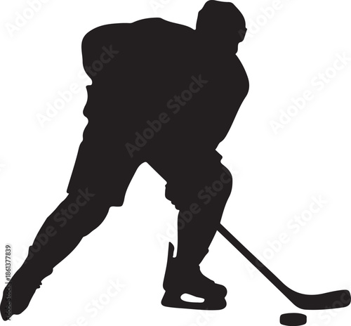 A silhouette of a hockey player actively skating with a puck