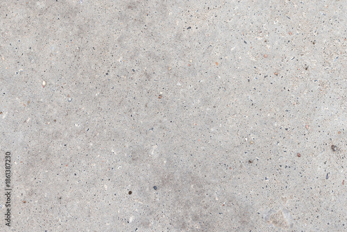 A close-up of a gray concrete pavement texture, background photo