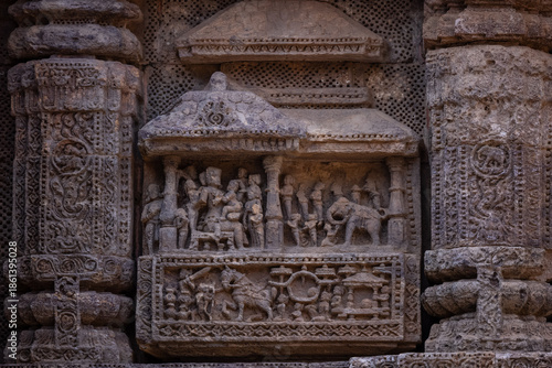 Architectural exterior view of ancient konark sun temple building built in 13th century by King Narasimhadeva in the state of odisha in india is an UNESCO world heritage site. Kamasutra poses carving.