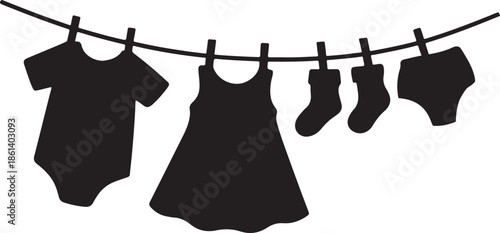Baby clothes hanging on a clothesline