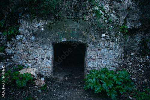 Ancient stone tunnel entrance in the Rock of Gibraltar — historic military passage