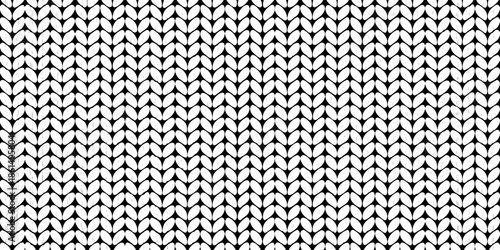 Detailed black and white knit texture displaying a repeating vertical rib pattern