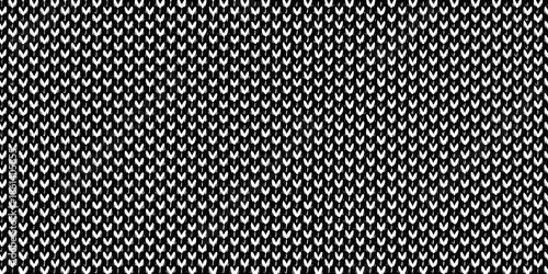 A close up view of a black and white woven textile pattern