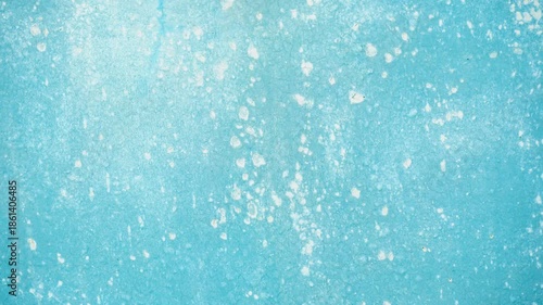 Blue grunge concrete background with cracked paint and saltpeter texture.