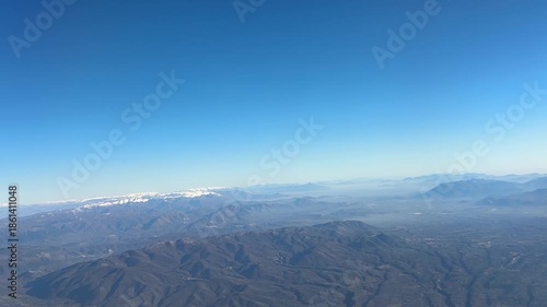 Colli Albani mountains aerial view blue sky misty landscape from airplane window over Rome Italy, volcanic hills natural terrain concept of geography, aviation, nature