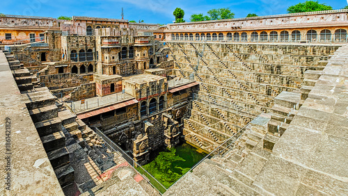Chand Baori in Abhaneri, built in the 8th–9th century CE by King Chanda, is a deep, geometric stepwell with 3,500 steps, showcasing ancient water conservation, climate-smart design.