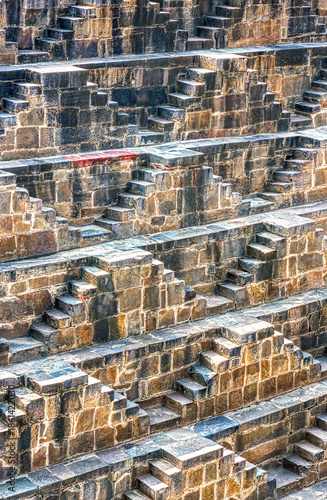 Chand Baori in Abhaneri, built in the 8th–9th century CE by King Chanda, is a deep, geometric stepwell with 3,500 steps, showcasing ancient water conservation, climate-smart design.